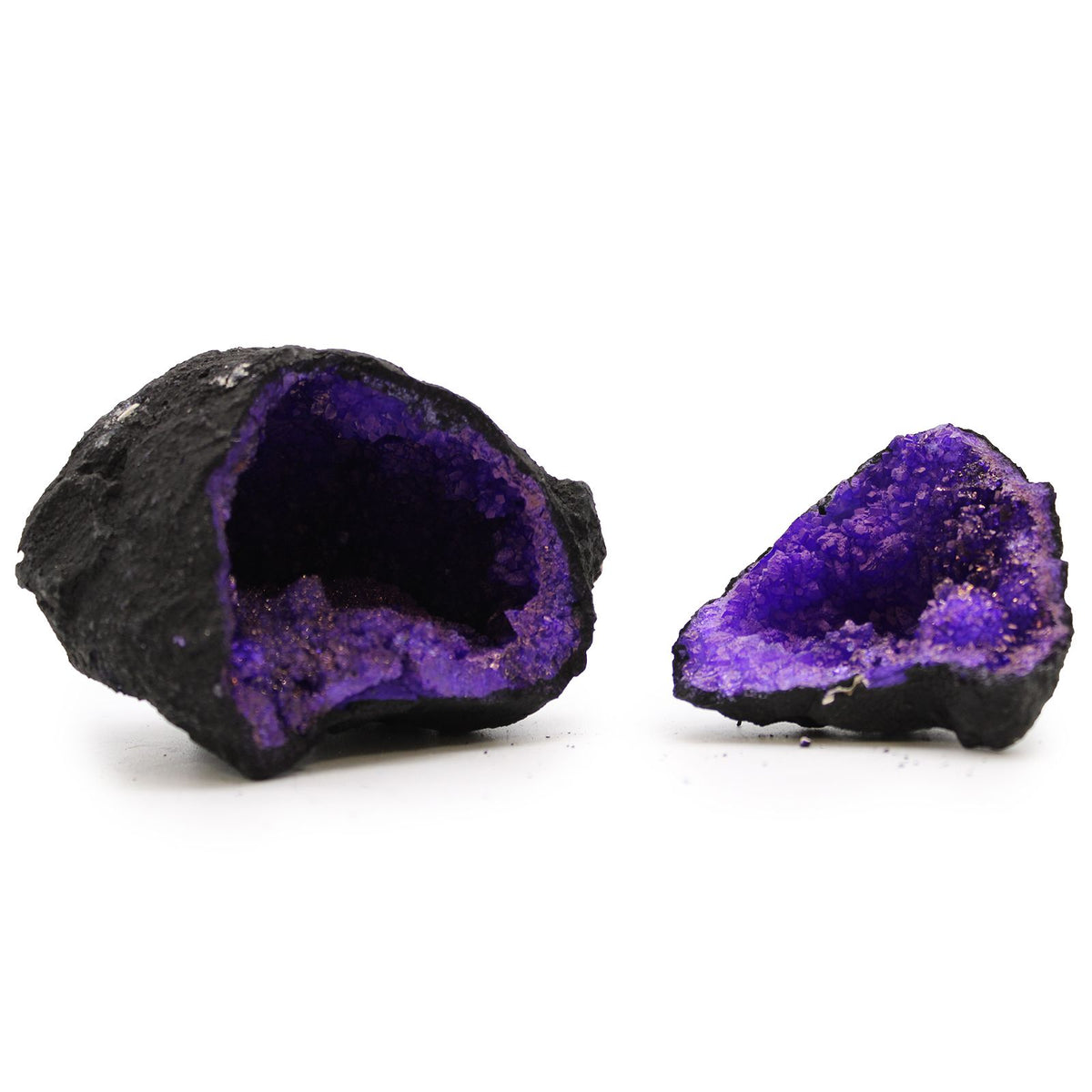 Purple Coloured Calcite Geode on Black Rock